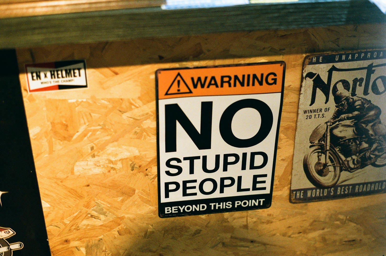 a sign that says no stupid people beyond this point